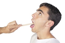 photo of student getting his throat examined